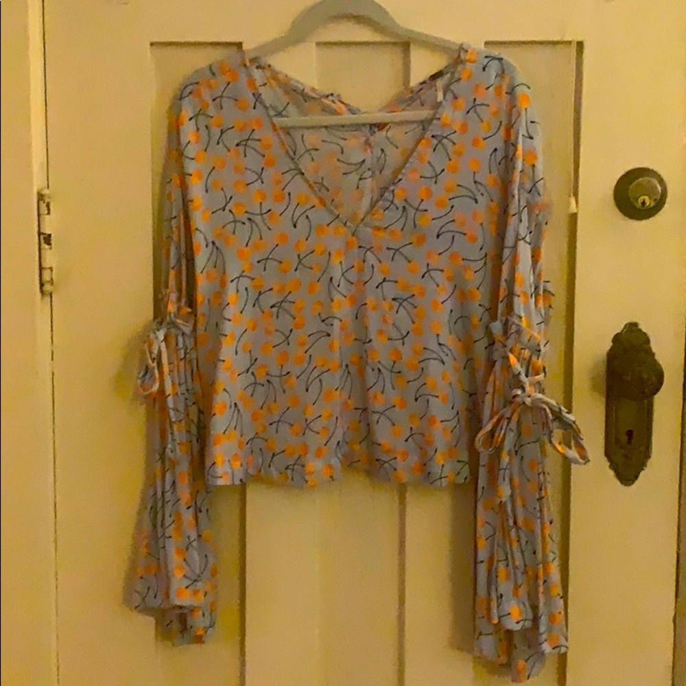 Free People cherry print bell sleeve top